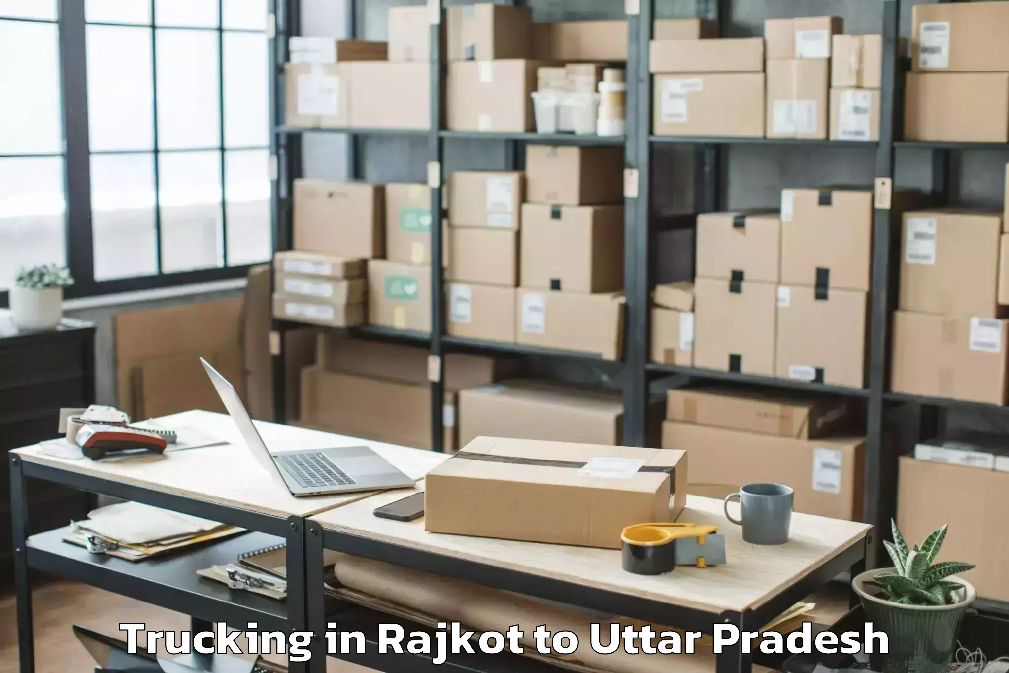 Reliable Rajkot to Manjhanpur Trucking